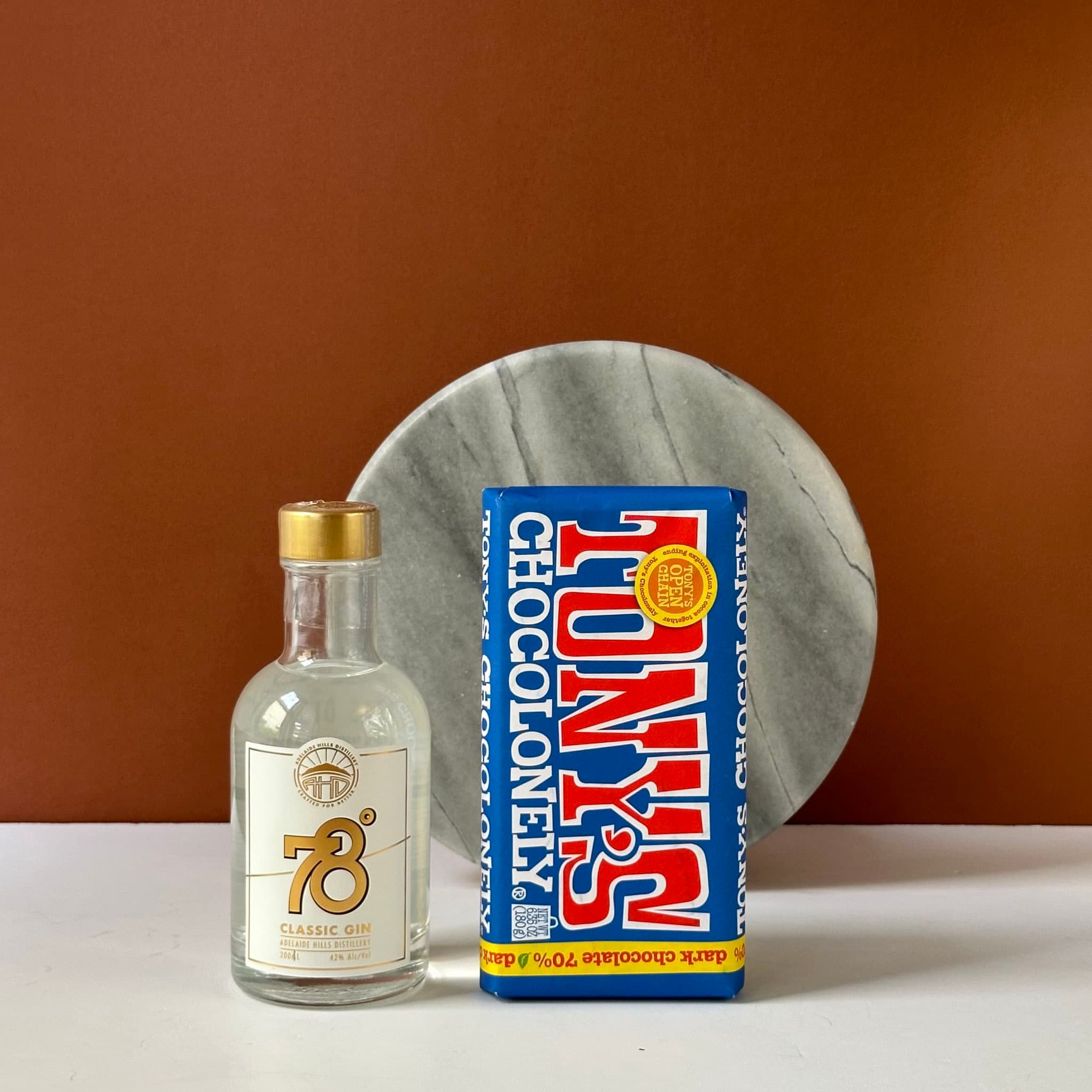 A delightful gift bundle featuring 78 Degrees Classic Gin and Tony's Chocolonely dark chocolate, elegantly presented in a premium Thankly black box.