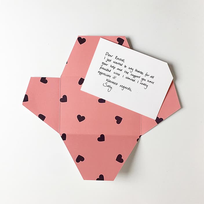 Signature Thankly Card with the Hearts envelope, pink with little black hearts.